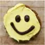 A cookie with a smiley face on it.